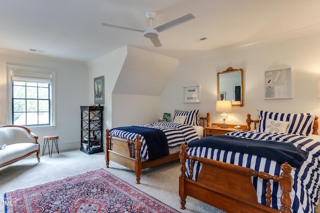 bedroom with carpet, visible vents, and ceiling fan