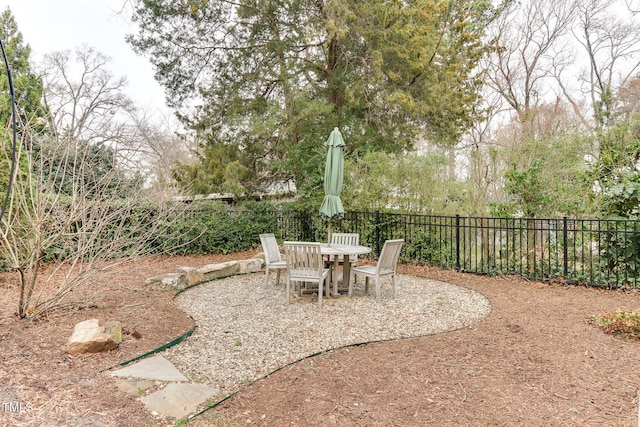 view of patio / terrace with outdoor dining area and fence