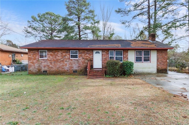 ranch-style house featuring crawl space, a chimney, fence, and a front yard