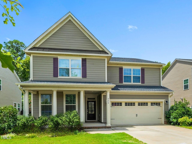 view of front facade featuring a garage, driveway, a porch, and roof with shingles