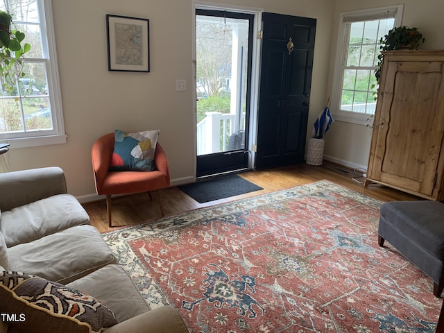 entrance foyer with wood finished floors and baseboards