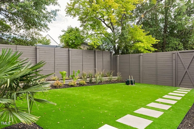 view of yard featuring a fenced backyard