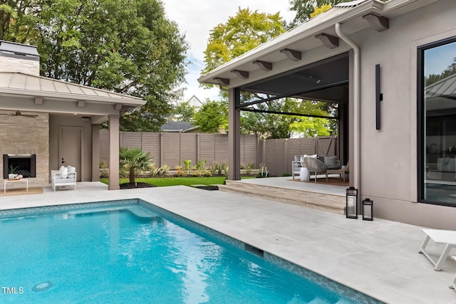 view of pool featuring a fenced in pool, a patio, and fence