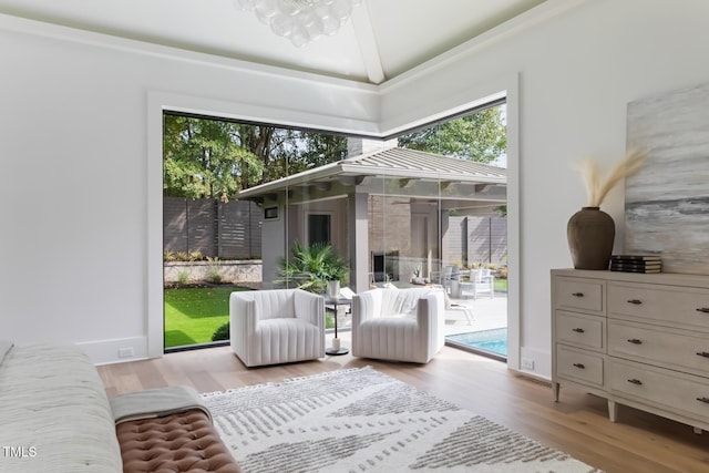 sitting room with lofted ceiling and wood finished floors