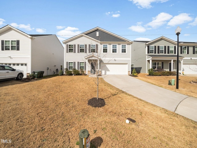 traditional-style home featuring a front yard, driveway, and an attached garage