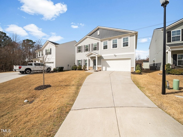 view of front of home featuring central AC unit, a garage, driveway, board and batten siding, and a front yard