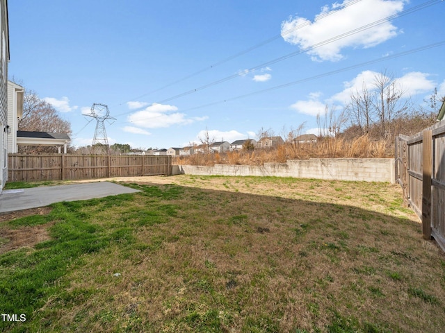 view of yard with a fenced backyard and a patio