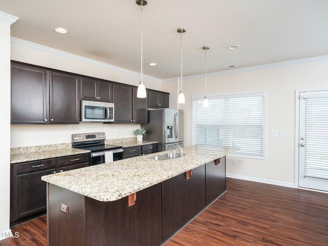 kitchen with crown molding, a breakfast bar area, appliances with stainless steel finishes, dark wood-type flooring, and a sink