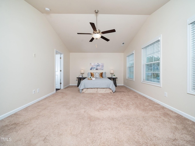 unfurnished bedroom featuring high vaulted ceiling, carpet, baseboards, and ceiling fan