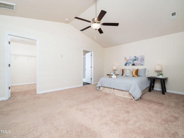 bedroom with lofted ceiling, carpet, and visible vents