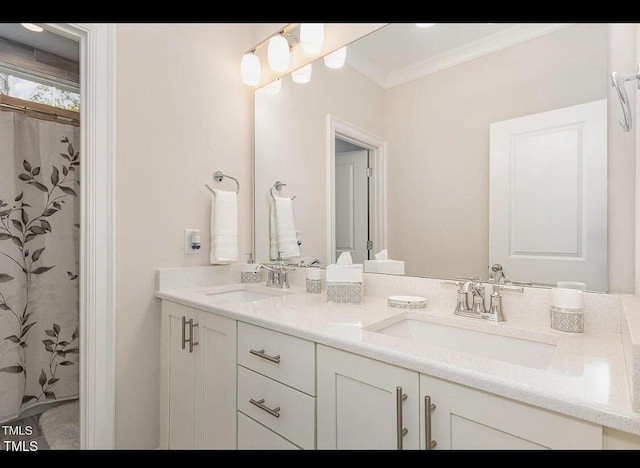 full bath with ornamental molding, a sink, and double vanity