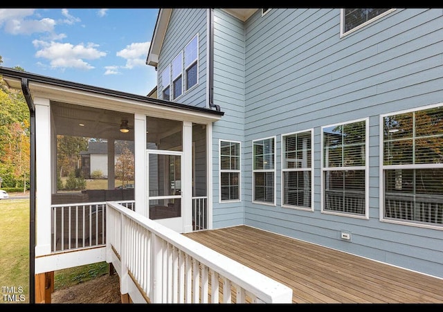 wooden terrace featuring a sunroom