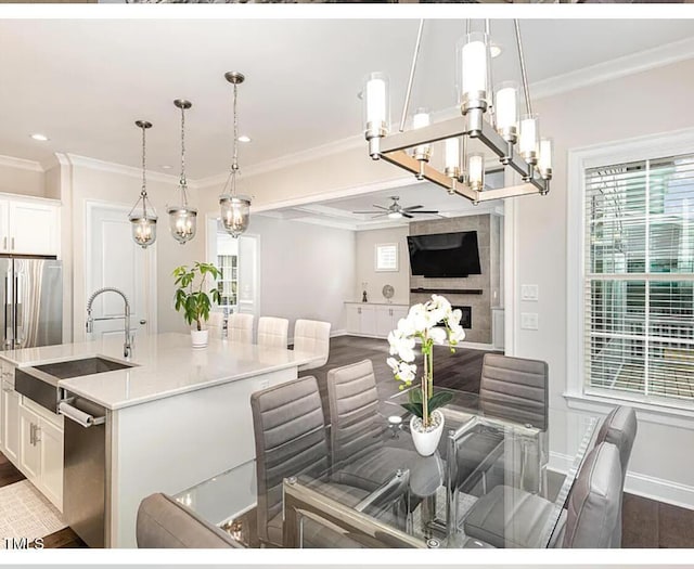 dining area with recessed lighting, ceiling fan with notable chandelier, dark wood-style flooring, baseboards, and ornamental molding