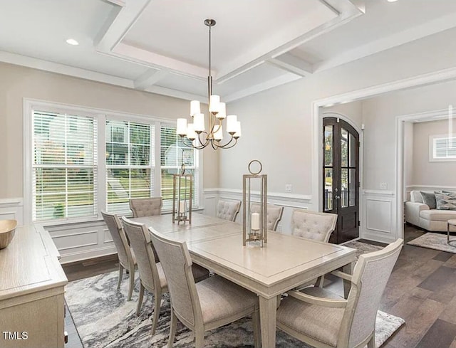 dining room featuring dark wood-type flooring, coffered ceiling, and beam ceiling