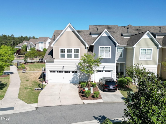 4137 Strendal Dr, Cary, NC 27519 - view of property with board and batten siding, roof with shingles, a residential view, concrete driveway, and an attached garage