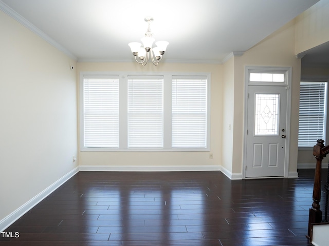4137 Strendal Dr, Cary, NC 27519 - foyer with an inviting chandelier, baseboards, and ornamental molding