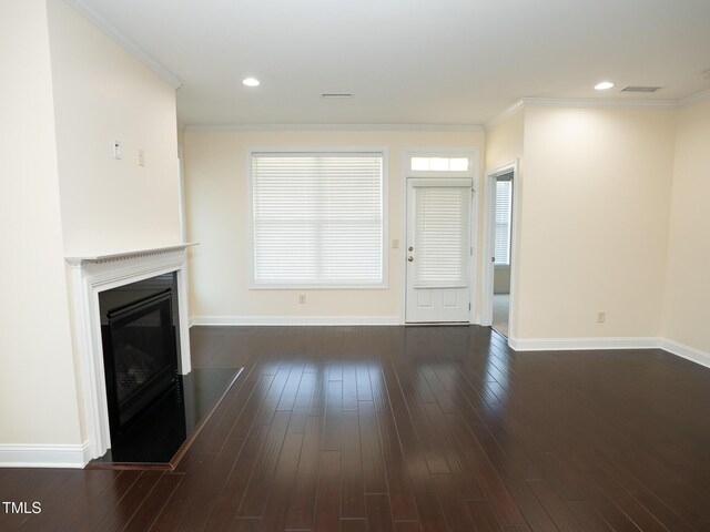 4137 Strendal Dr, Cary, NC 27519 - unfurnished living room featuring a glass covered fireplace, baseboards, dark wood-style flooring, and visible vents