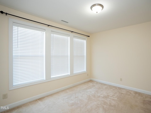 4137 Strendal Dr, Cary, NC 27519 - spare room with baseboards, a wealth of natural light, carpet, and visible vents