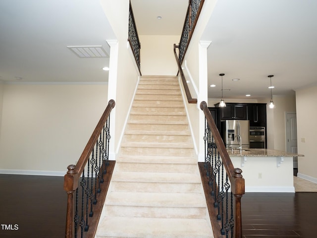 4137 Strendal Dr, Cary, NC 27519 - staircase featuring recessed lighting, baseboards, wood finished floors, and visible vents