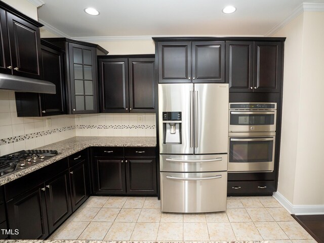 4137 Strendal Dr, Cary, NC 27519 - kitchen featuring crown molding, appliances with stainless steel finishes, tasteful backsplash, and under cabinet range hood