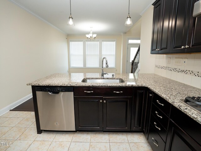 4137 Strendal Dr, Cary, NC 27519 - kitchen featuring crown molding, an inviting chandelier, a sink, stainless steel appliances, and decorative backsplash