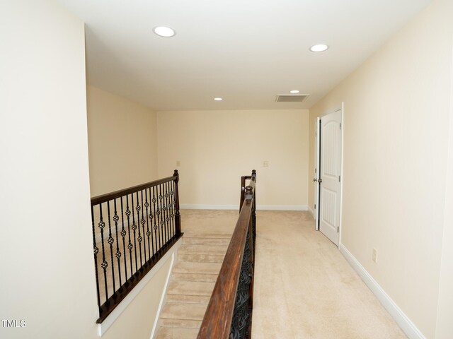 4137 Strendal Dr, Cary, NC 27519 - corridor featuring visible vents, baseboards, an upstairs landing, light carpet, and recessed lighting