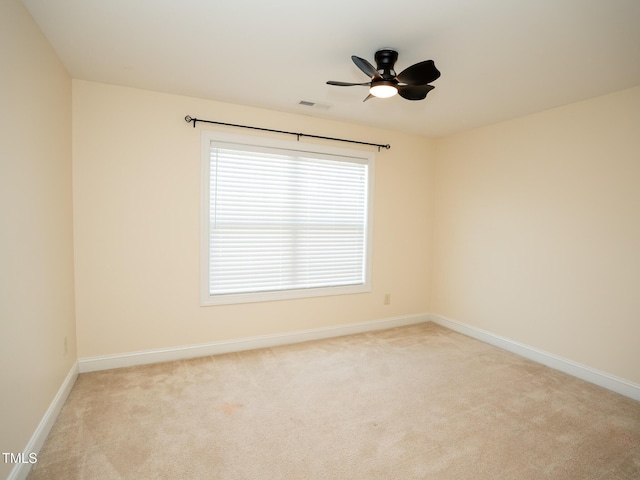 4137 Strendal Dr, Cary, NC 27519 - empty room featuring visible vents, baseboards, ceiling fan, plenty of natural light, and light colored carpet