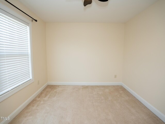 4137 Strendal Dr, Cary, NC 27519 - unfurnished room featuring baseboards, ceiling fan, a wealth of natural light, and light carpet