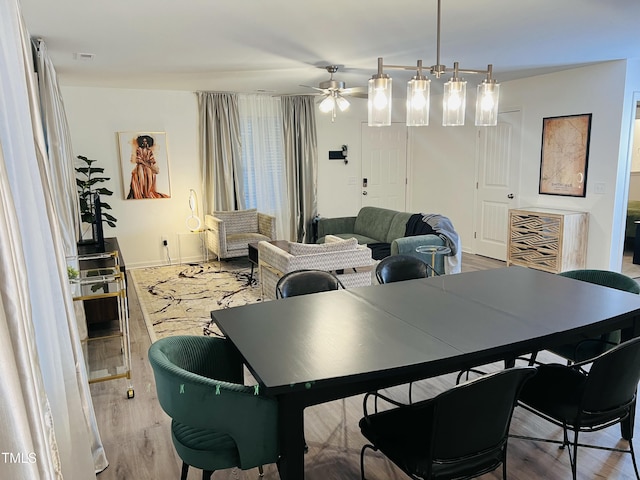 dining area featuring ceiling fan and wood finished floors