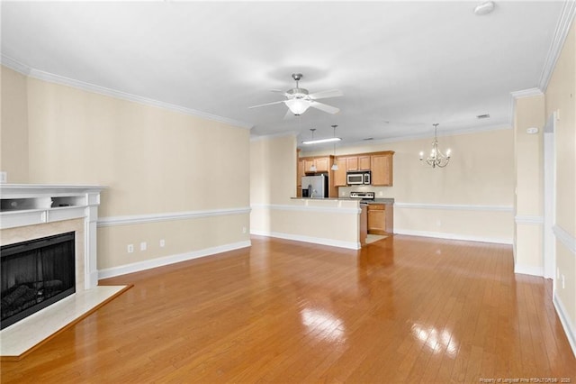 unfurnished living room with baseboards, light wood-style flooring, ornamental molding, ceiling fan with notable chandelier, and a high end fireplace