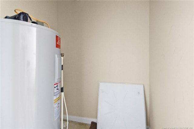 utility room with electric water heater