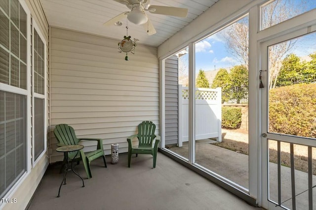 sunroom with a ceiling fan