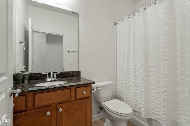 bathroom with tile patterned flooring, shower / bath combo with shower curtain, toilet, and vanity