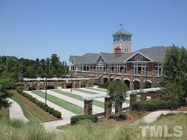 view of home's community featuring shuffleboard