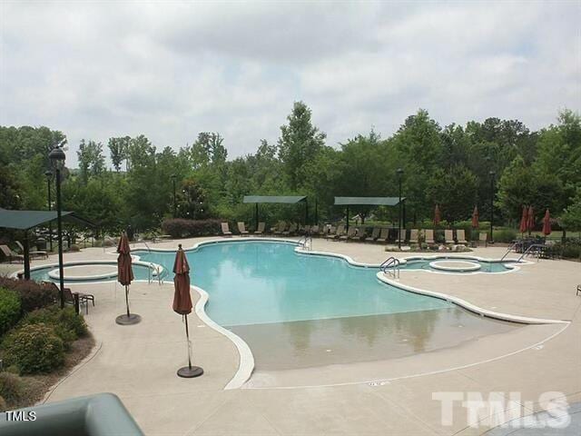 pool with a patio area