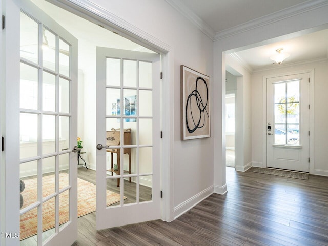 doorway with ornamental molding, french doors, baseboards, and dark wood-style floors