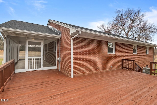 wooden terrace with a sunroom