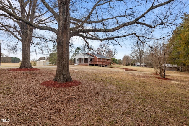 view of yard with a wooden deck