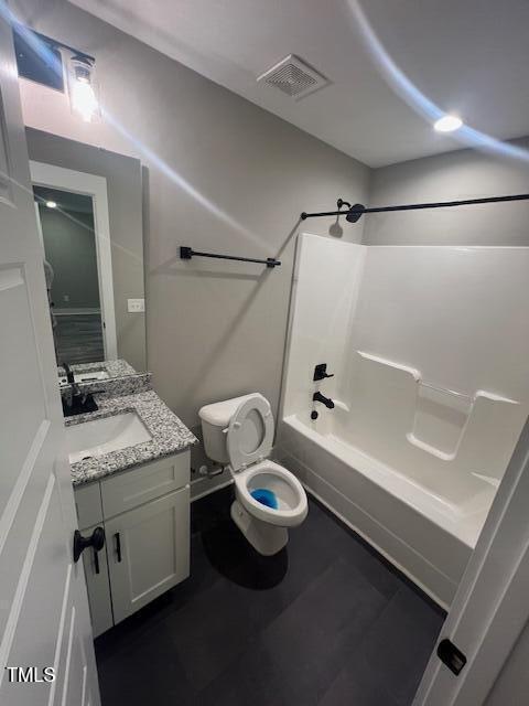 full bathroom featuring visible vents, toilet, vanity, and  shower combination