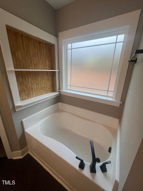 full bathroom with a garden tub