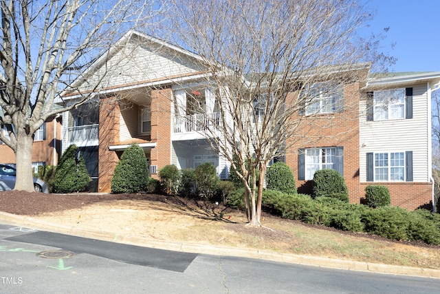 view of front of property featuring brick siding