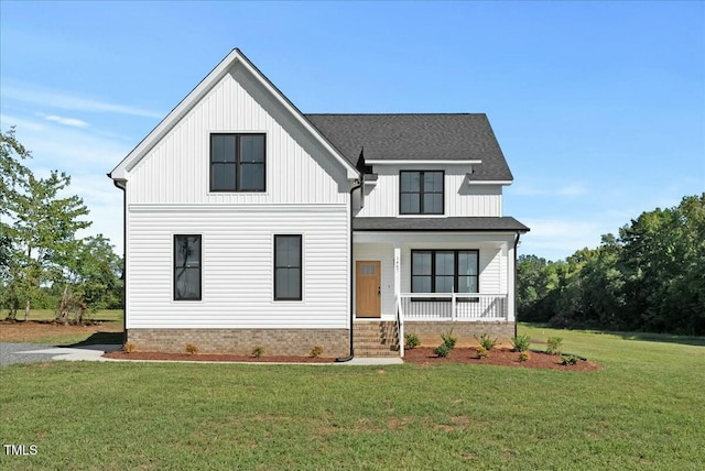 modern farmhouse with covered porch, roof with shingles, a front lawn, and board and batten siding