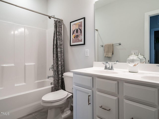 full bath with a sink, shower / bathtub combination with curtain, toilet, and double vanity