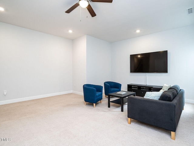 carpeted living area with visible vents, recessed lighting, a ceiling fan, and baseboards