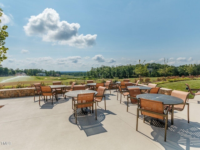 view of patio / terrace featuring outdoor dining space and an outdoor fire pit