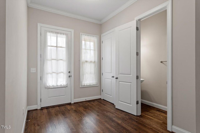 doorway to outside with baseboards, ornamental molding, and dark wood-type flooring