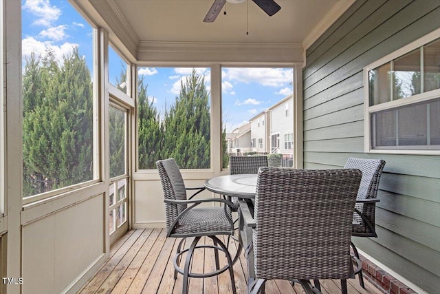 sunroom with a ceiling fan