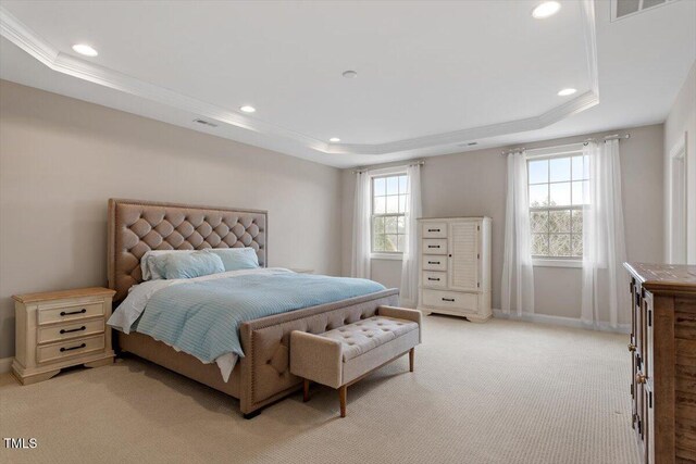 bedroom with baseboards, a raised ceiling, visible vents, and recessed lighting