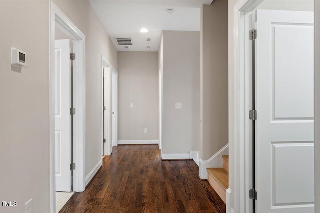 hall with recessed lighting, wood finished floors, visible vents, and baseboards