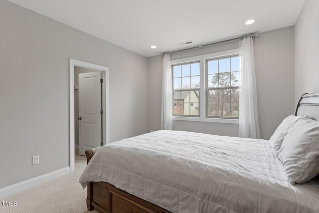 carpeted bedroom with visible vents, baseboards, and recessed lighting